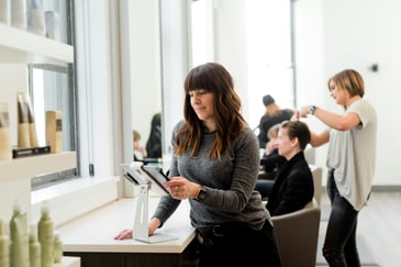 business-woman-looking-at-phone